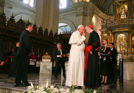 Pope Francis talks to Vatican Secretary of State, Cardinal Pietro Parolin, as they arrive at the Cathedral San Juan Apostol y Evangelista in Lima, Peru, January 21, 2018. REUTERS/Alessandro Bianchi