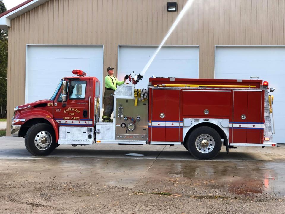 A Superior Township Fire Department truck is shown.