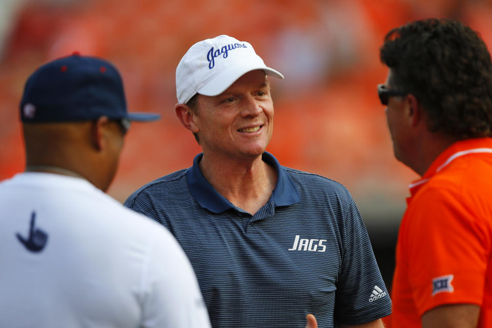 STILLWATER, OK - SEPTEMBER 16:  Assistant coach Major Applewhite of the South Alabama Jaguars talks with head coach Mike Gundy of the Oklahoma State Cowboys before their game at Boone Pickens Stadium on September 16, 2023 in Stillwater, Oklahoma. South Alabama won 33-7.  (Photo by Brian Bahr/Getty Images)