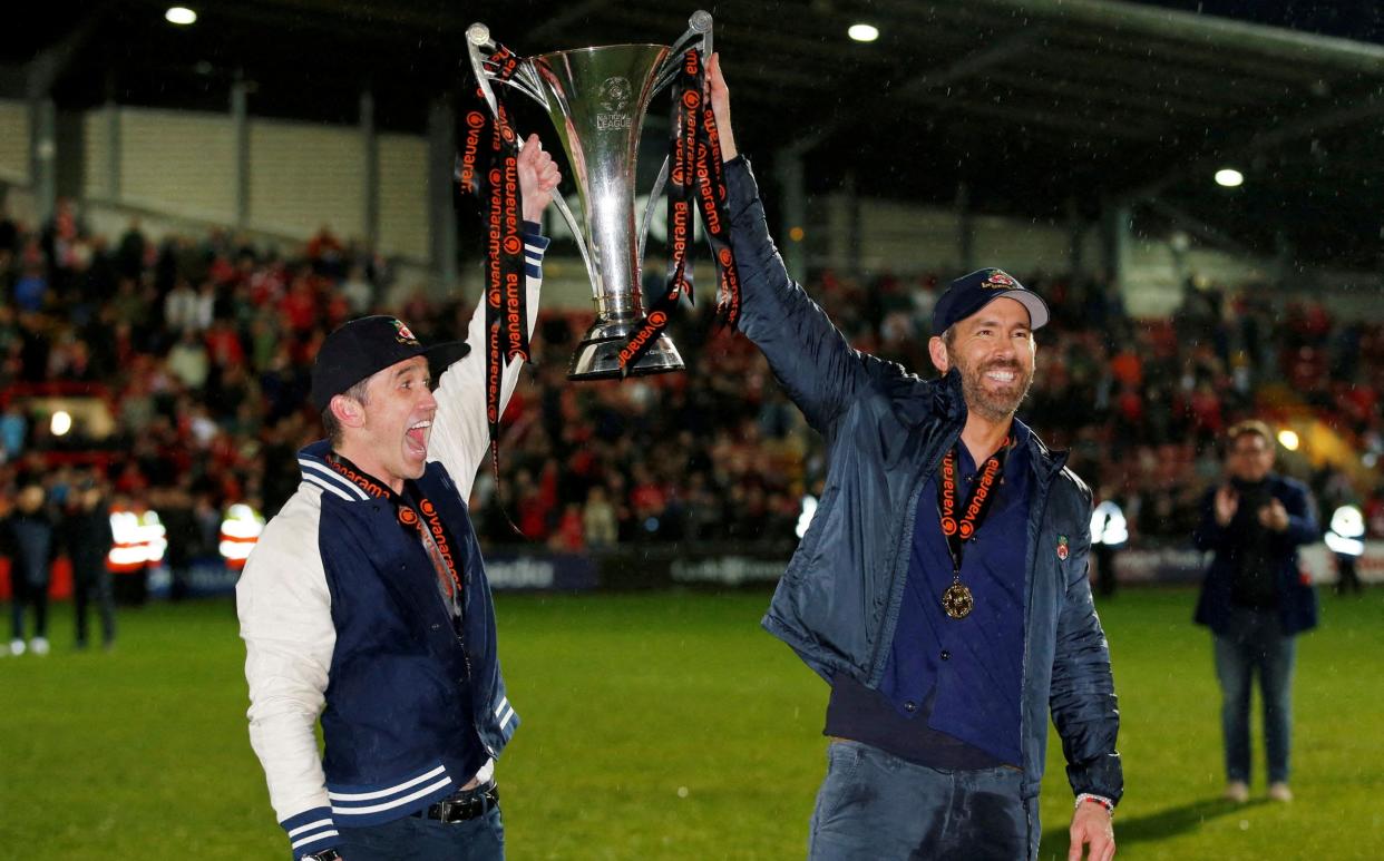 Wrexham co-owners Rob McElhenney and Ryan Reynolds celebrate after Wrexham win the National League and promotion to League Two - Action Images via Reuters/Ed Sykes