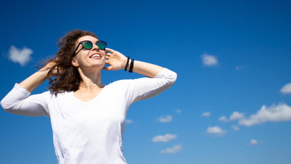 Woman wearing a white top outside