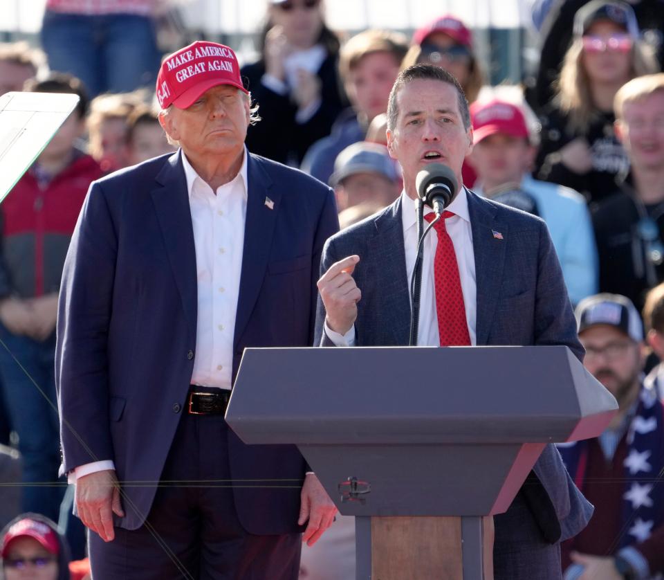 March 16, 2024; Dayton, Ohio, USA; 
Former President Donald Trump appears with U.S. Senate candidate Bernie Moreno outside Wright Bros. Aero Inc at the Dayton International Airport on Saturday.