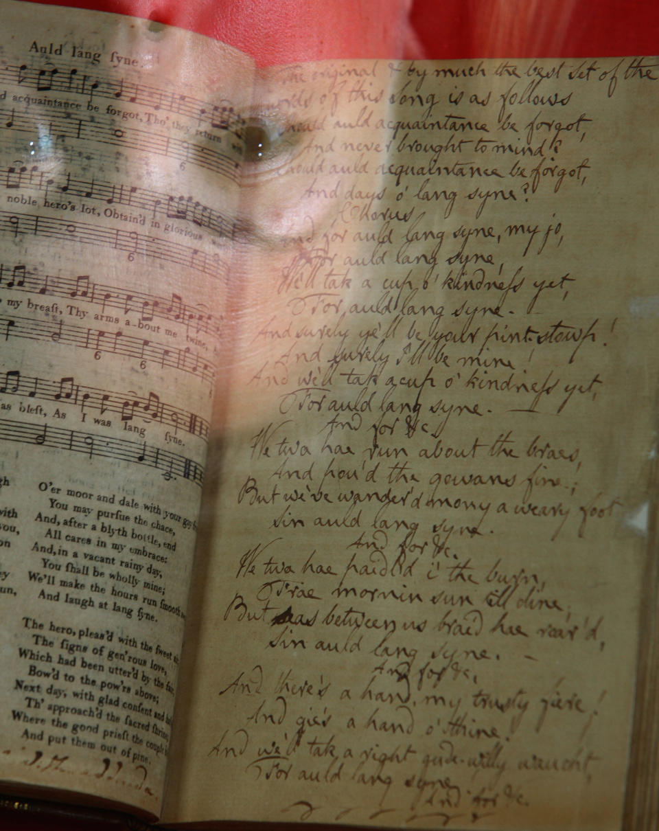 Corrine Bowen, of Bonhams auctioneers views the Robert Burns manuscript and lyrics to Auld Lang Syne on Aug. 11, 2009 in Edinburgh, Scotland. / Credit: Jeff J Mitchell / Getty Images