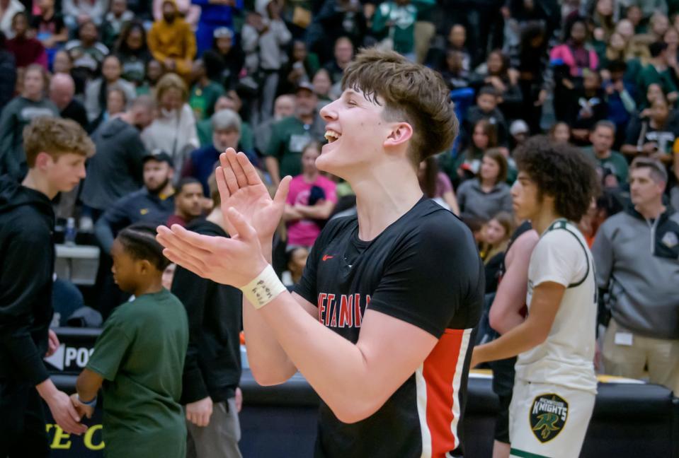 Metamora's Matthew Zobrist claps for his team after the Redbird's 65-50 victory over Richwoods in the Class 3A Sectional title game Friday, March 3, 2023 at Galesburg High School.