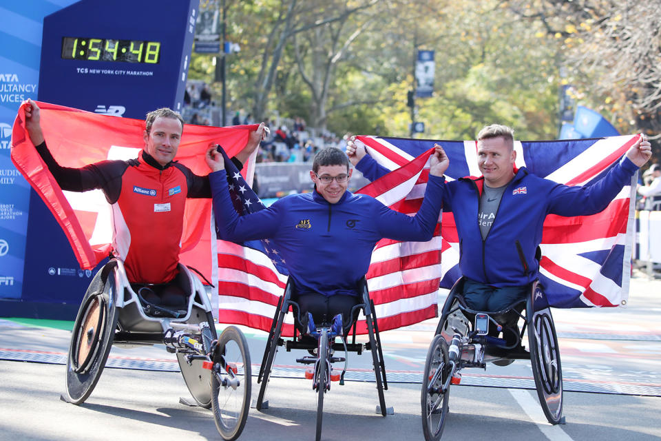 Second place winner, Marcel Hug,first place winner Daniel Romanchuk and third place winner David Weir celebrate during the TCS New York City Marathon on Nov. 3, 2019 in New York City. (Photo: PhotoRun/New York Road Runners via Getty Images)