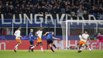 FILE - In this Wednesday, Feb. 19, 2020 file photo, spectators sit in the stands during the Champions League round of 16, first leg, soccer match between Atalanta and Valencia at the San Siro stadium in Milan, Italy. It was the biggest soccer game in Atalanta’s history and a third of Bergamo’s population made the short trip to Milan’s famed San Siro Stadium to witness it. Nearly 2,500 fans of visiting Spanish club Valencia also traveled to the Champions League match. More than a month later, experts are pointing to the Feb. 19 game as one of the biggest reasons why Bergamo has become one of the epicenters of the coronavirus pandemic — a “biological bomb” was the way one respiratory specialist put it — and why 35% of Valencia’s team became infected. The new coronavirus causes mild or moderate symptoms for most people, but for some, especially older adults and people with existing health problems, it can cause more severe illness or death. (AP Photo/antonio Calanni, File)