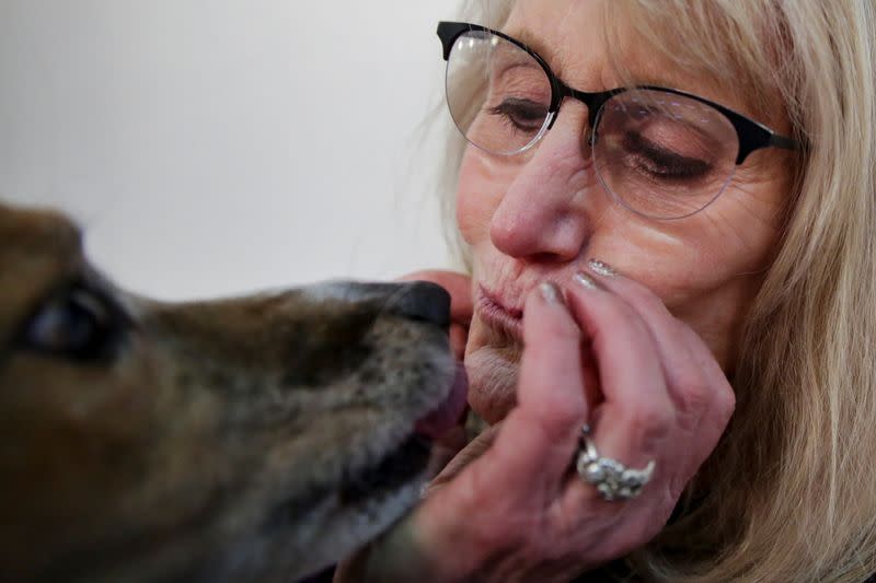 Drew, an Australian shepherd dog, kisses its owner, Hellen Halperin of New Jersey after taking part in the Masters Agility Championship during the Westminster Kennel Club Dog Show in New York