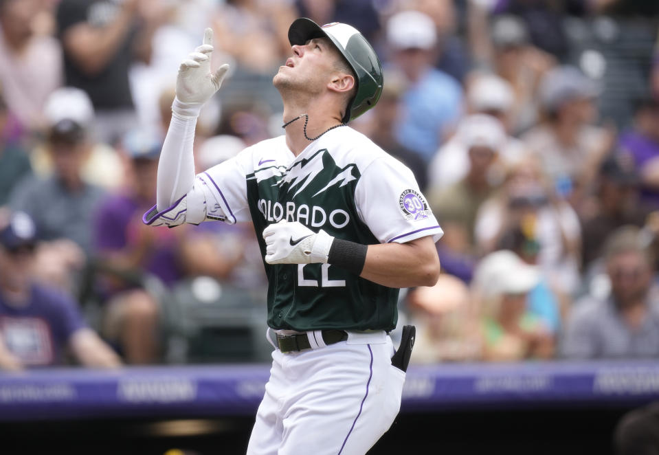 Colorado Rockies' Nolan Jones gestures as he crosses home plate after hitting a solo home run off San Diego Padres starting pitcher Ryan Weathers in the second inning of a baseball game Saturday, June 10, 2023, in Denver. (AP Photo/David Zalubowski)