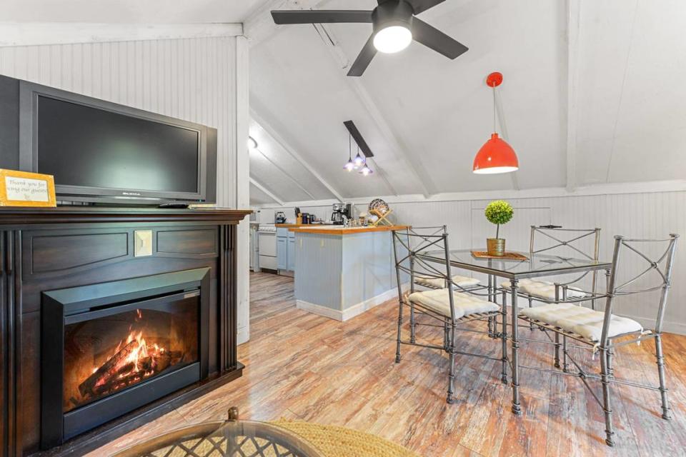 The upstairs apartment on the Breezy Porches property features an open floor plan with one bedroom off the kitchen. MS Real Estate Photography