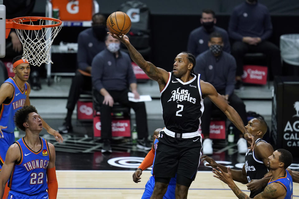 Los Angeles Clippers forward Kawhi Leonard (2) shoots during the first quarter of the team's NBA basketball game against the Oklahoma City Thunder on Friday, Jan. 22, 2021, in Los Angeles. (AP Photo/Ashley Landis)