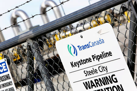 FILE PHOTO: A TransCanada Keystone Pipeline pump station operates outside Steele City, Nebraska, U.S. on March 10, 2014. REUTERS/Lane Hickenbottom/File Photo