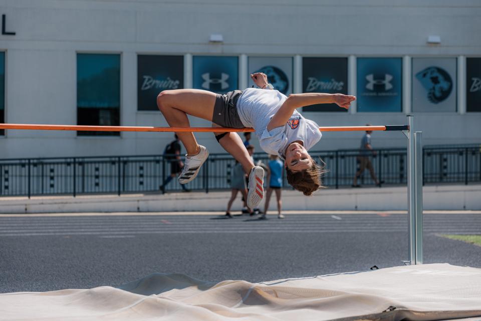 Ragen Hodge leaps over the bar during Bartlesville track practice on Wednesday. Hodge is the only team member that has competed in two previous state meets (2019, 2021).