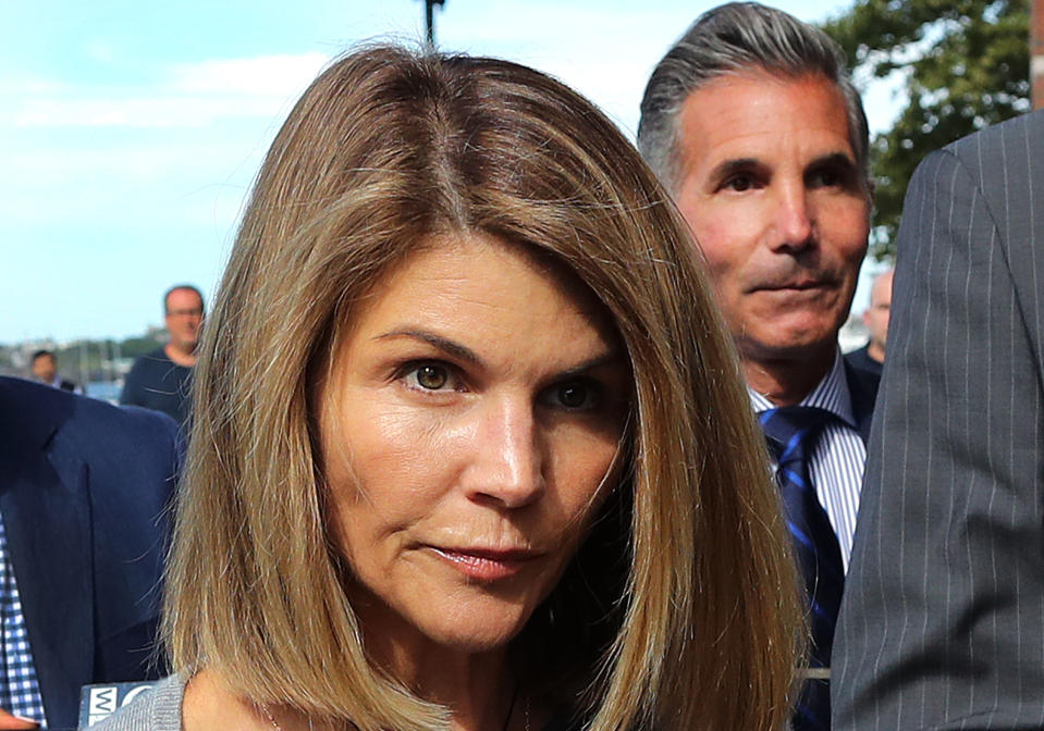 BOSTON, MA - AUGUST 27: Lori Loughlin and her husband Mossimo Giannulli, right, leave the John Joseph Moakley United States Courthouse in Boston on Aug. 27, 2019. A judge says actress Lori Loughlin and her fashion designer husband, Mossimo Giannulli, can continue using a law firm that recently represented the University of Southern California. The couple appeared in Boston federal court on Tuesday to settle a dispute over their choice of lawyers in a sweeping college admissions bribery case. Prosecutors had said their lawyers pose a potential conflict of interest. Loughlin and Giannulli say the firms work for USC was unrelated to the admissions case and was handled by different lawyers. (Photo by John Tlumacki/The Boston Globe via Getty Images)