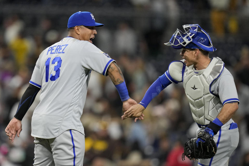 Kansas City Royals designated hitter Salvador Perez, left, celebrates with teammate catcher Freddy Fermin after the Royals defeated the San Diego Padres 5-4 in a baseball game Tuesday, May 16, 2023, in San Diego. (AP Photo/Gregory Bull)