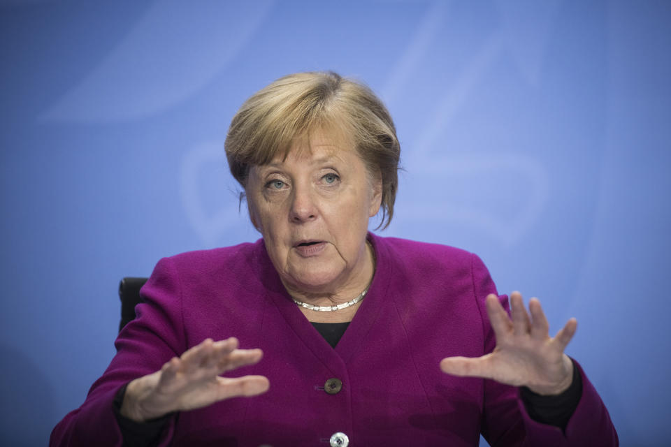 German Chancellor Angela Merkel addresses the media during a press conference after a meeting with the governors of the German states in Berlin, Germany, Wednesday, Oct. 14, 2020. (Stefanie Loos/Pool Photo via AP)