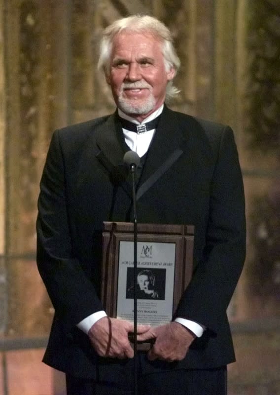 FILE PHOTO: Singer Kenny Rogers accepts a special Career Achievement Award at the 36th annual Academy of Country Music Awards in Los Angeles