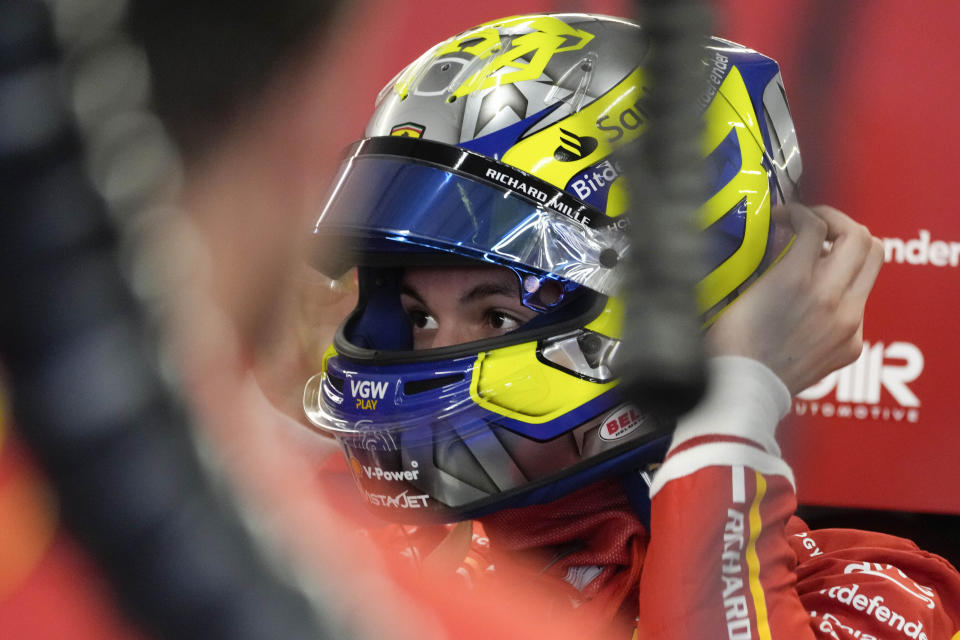 British Ferrari driver Oliver Bearman wears the helmet at pits prior to the third practice session ahead of the Formula One Saudi Arabian Grand Prix at the Jeddah Corniche Circuit in Jeddah, Saudi Arabia, Friday, March 8, 2024. Saudi Arabian Grand Prix will be held on Saturday, March 9, 2024. (AP Photo/Darko Bandic)
