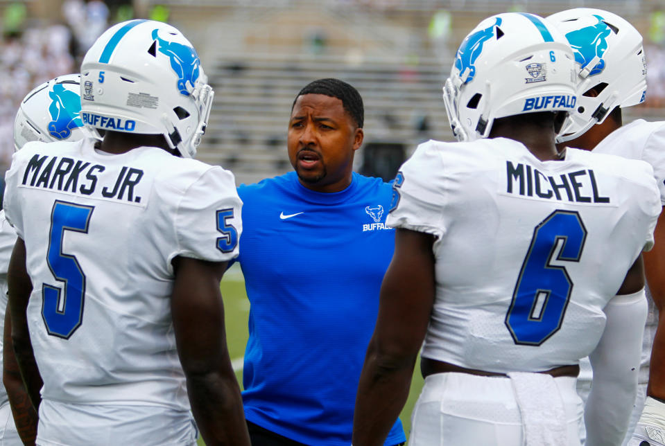 Sep 18, 2021; Buffalo, New York, USA; Buffalo Bulls head coach Maurice Linguist talks with running back Kevin Marks Jr. (5) and defensive end Max Michel (6) as the players prepared to take on Coastal Carolina Chanticleers at UB Stadium. Mandatory Credit: Nicholas LoVerde-USA TODAY Sports