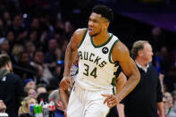 Milwaukee Bucks' Giannis Antetokounmpo reacts after making a basket during the second half of an NBA basketball game against the Philadelphia 76ers, Tuesday, March 29, 2022, in Philadelphia. (AP Photo/Matt Slocum)