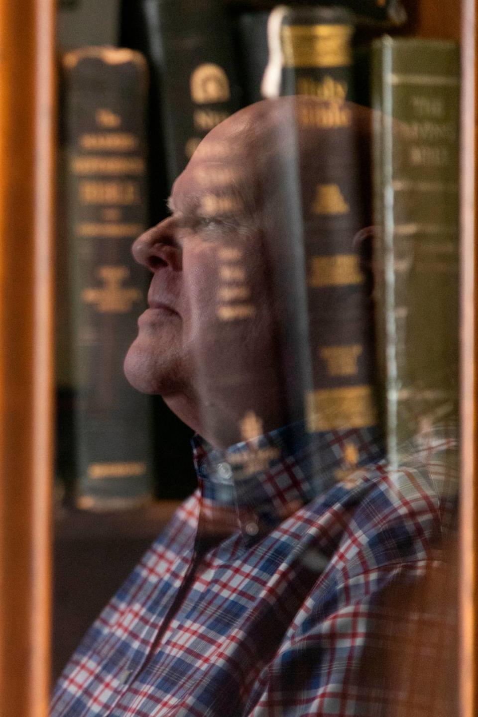 Jim Harvey, who helped craft S.C. execution protocols and oversaw 13 executions, is reflected in his collection of Bibles in 2021.