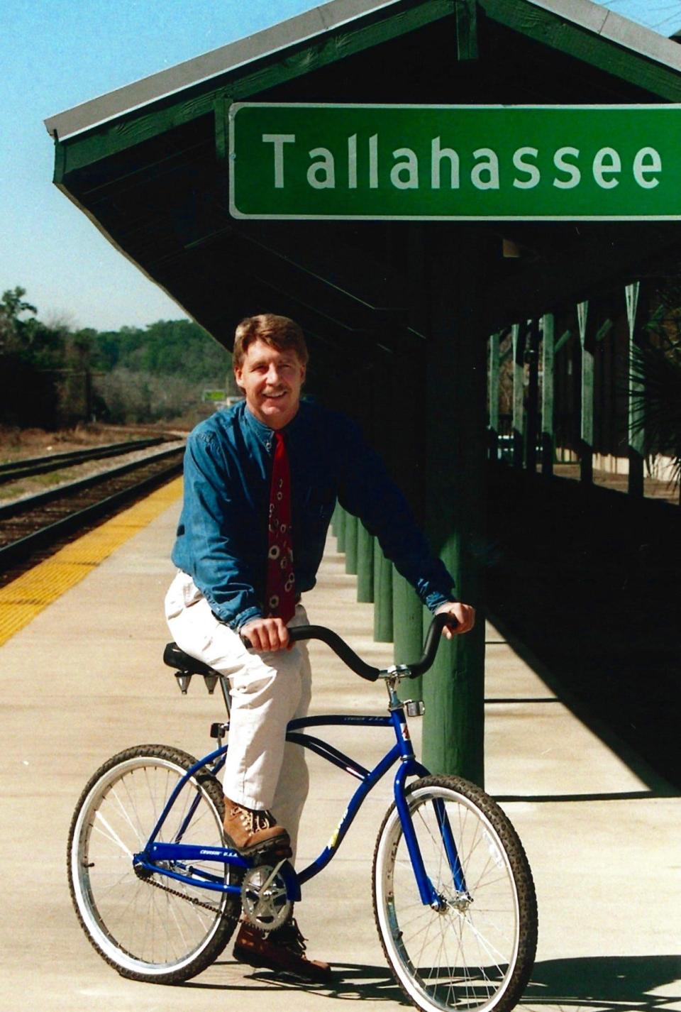 Gerald Ensley, a journalist with the Tallahassee Democrat for nearly 40 years, explores the Tallahassee train depot on his bike in this undated photo. Ensley died in 2018 but his history columns will help shape the coverage of the Tallahassee Bicentennial in 2024.