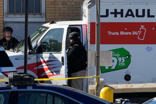 PHOTO: Members of the NYPD bomb squad examine a rental truck that was stopped and the driver arrested, Feb. 13, 2023, in New York. (John Minchillo/AP)