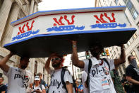 <p>Supporters of Sen. Bernie Sanders march near City Hall in Philadelphia, Tuesday, July 26, 2016, during the second day of the Democratic National Convention. (Photo: John Minchillo/AP)</p>