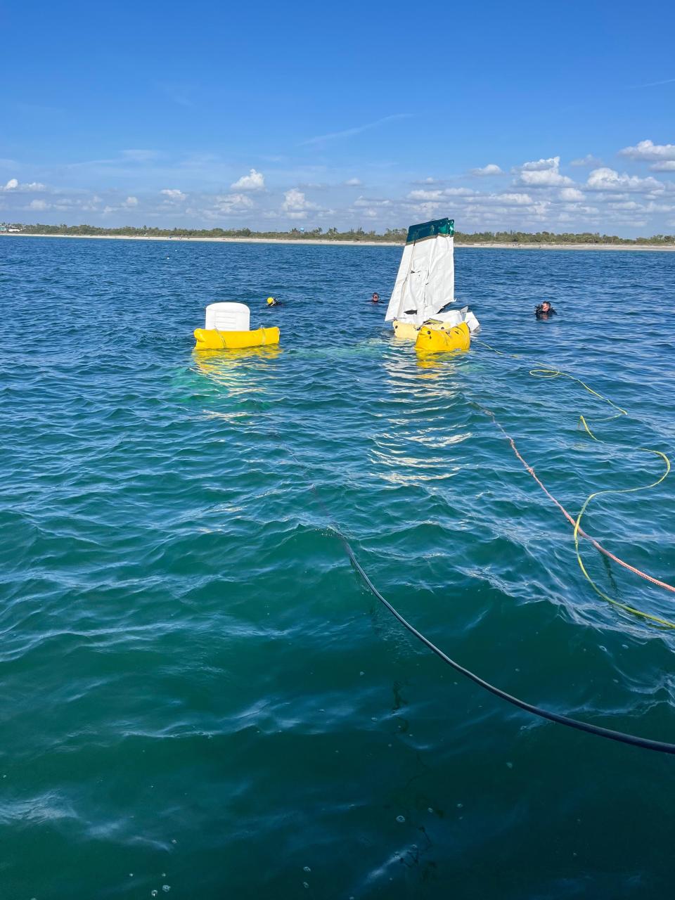 Divers worked Monday to attach cables to a 1976 Piper Cherokee that crashed Saturday night into the Gulf of Mexico Saturday night. The plane sank in 15 feet of water about one-third of a mile off of the Venice Municipal Airport. The craft had to be brought to the surface so Sea Tow Venice could bring it to the shore via the boat ramp in Higel Park.