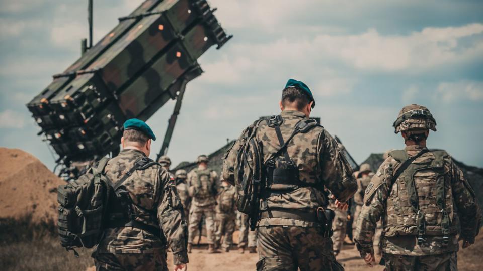 American and Polish service members walk to the site of a Patriot missile system for a verbal demonstration of its operation and capabilities near Drawsko Pomorskie, Poland, in 2018. (Spc. Aaron Good/Michigan Army National Guard)