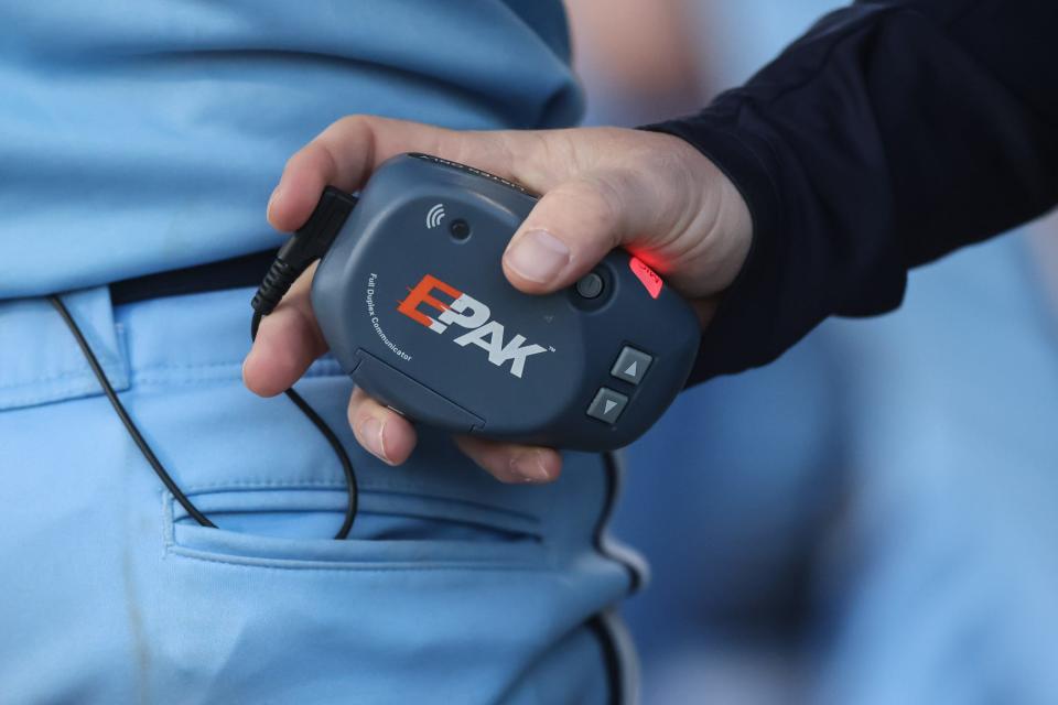 Franklin senior Michael Davide wears a two-way radio during the baseball game against Milford at Fino Field in Milford on May 01, 2024.