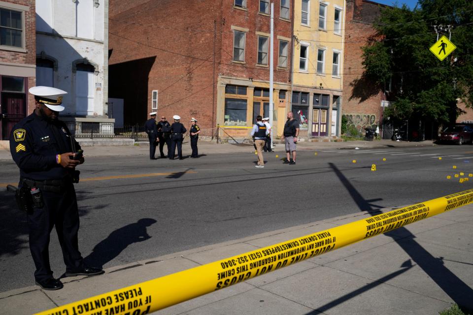 Cincinnati police investigate a quadruple shooting at McMicken Avenue and Lang Street in Over-the-Rhine on Wednesday, May 31, 2023. The victims, including three juveniles, have non-life-threatening injuries.