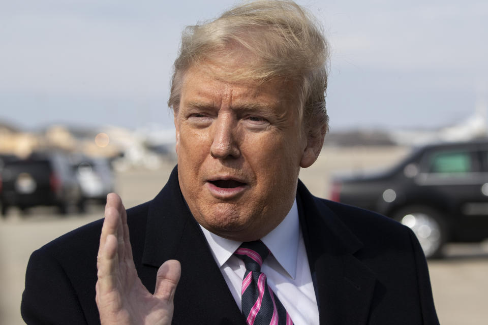 President Donald Trump speaks with reporters as he boards Air Force One as he departs Tuesday, Feb. 18, 2020, at Andrews Air Force Base, Md.(AP Photo/Alex Brandon)