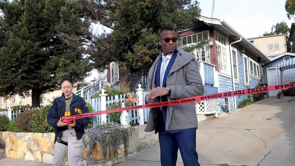 Representatives of the San Luis Obispo County Sheriff’s Office and FBI conduct a warrant search of the Flores house in the 500 block of East Branch in February 2020. Sheriff’s Office Cmdr. Keith Scott, head of the detective bureau, is on the right.