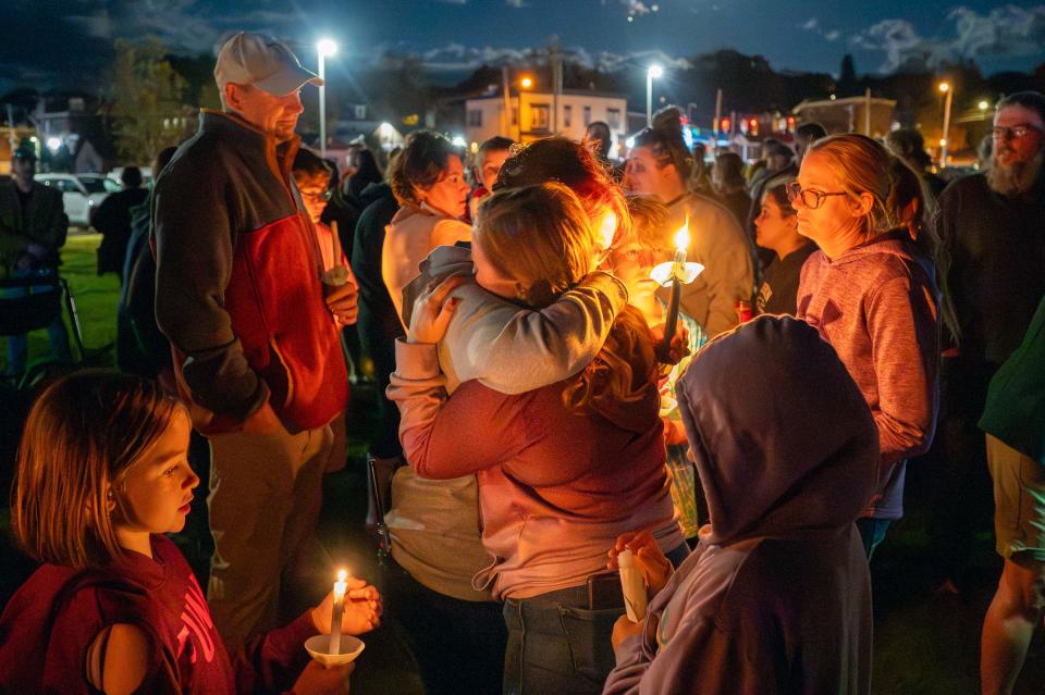 Community members gather for a vigil in Lisbon, Maine, on Saturday to remember those killed in the mass shootings in Lewiston, Maine.