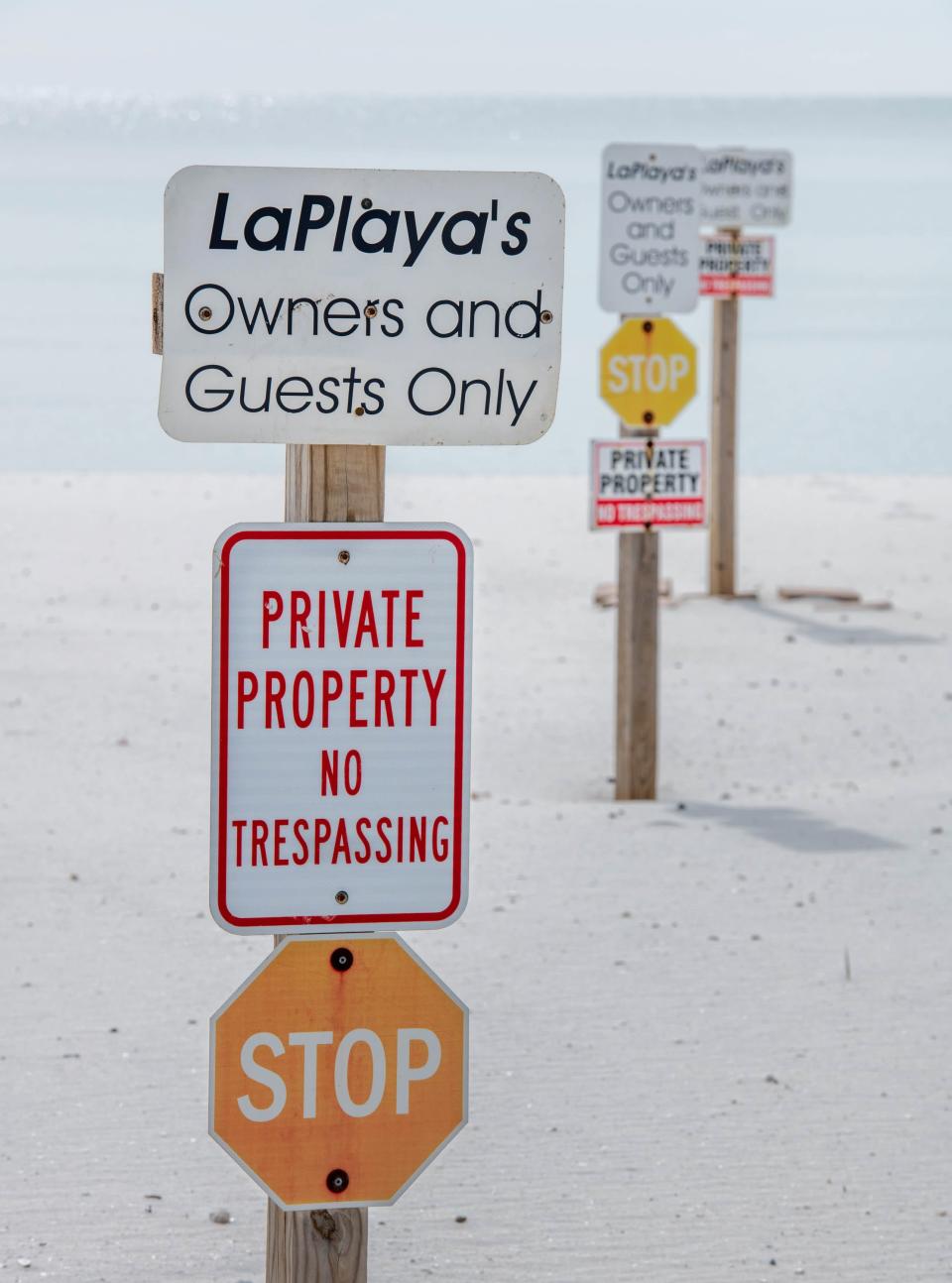 A group of local residents wants Escambia County to remove the dozens of "private property" and "no trespassing" signs dotting the sandy areas of the beaches on Perdido Key, saying they are an eyesore and unwelcoming to beach visitors.