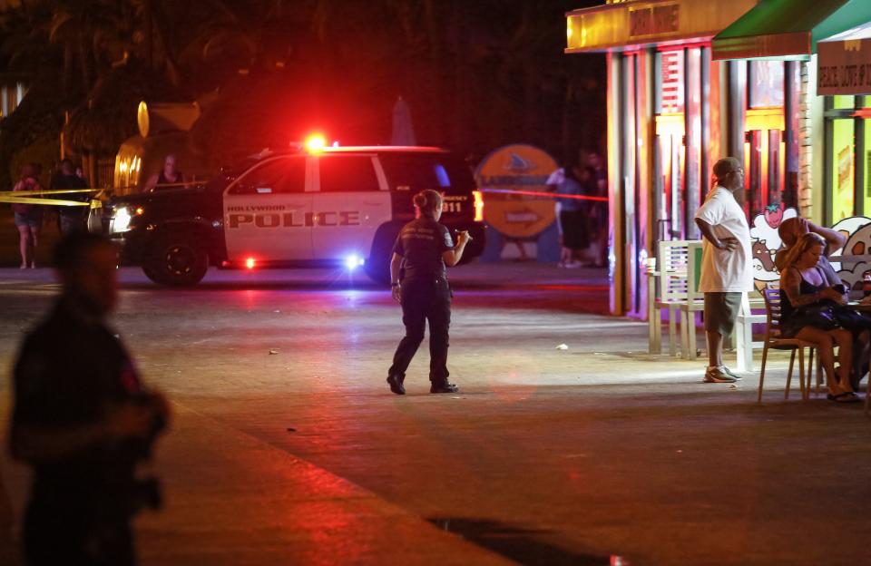 A police officer walks around the scene of the mass shooting.