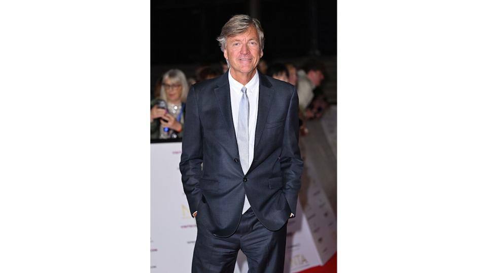 Richard Madeley on the red carpet in a navy suit