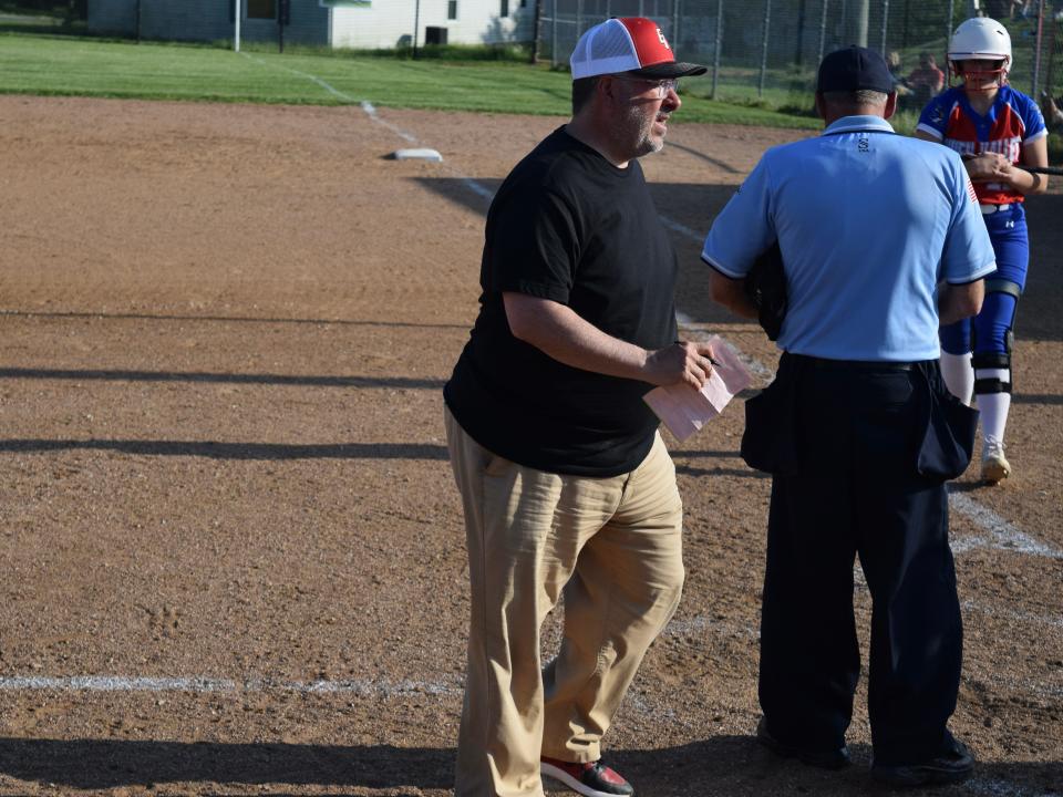 Eastern Greene head softball coach Tommy Bell makes a defensive change during the Thunderbirds' loss to Owen Valley. (Seth Tow/Herald-Times)