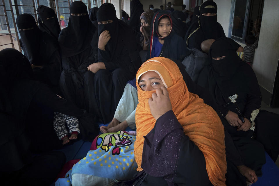 Women sit inside a room at a makeshift shelter set up for residents of coastal areas, in Teknaf, near Cox's Bazar, Bangladesh, Sunday, May 14, 2023. Bangladesh and Myanmar braced Sunday as a severe cyclone started to hit coastal areas and authorities urged thousands of people in both countries to seek shelter. (AP Photo/Al-emrun Garjon)