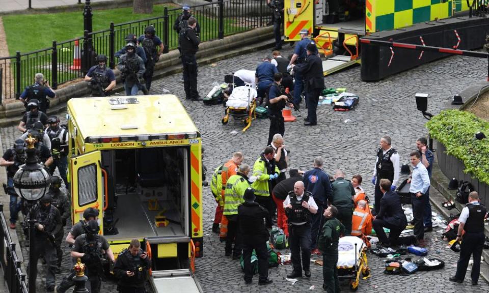 Paramedics and police outside the Palace of Westminster after a terrorist attack