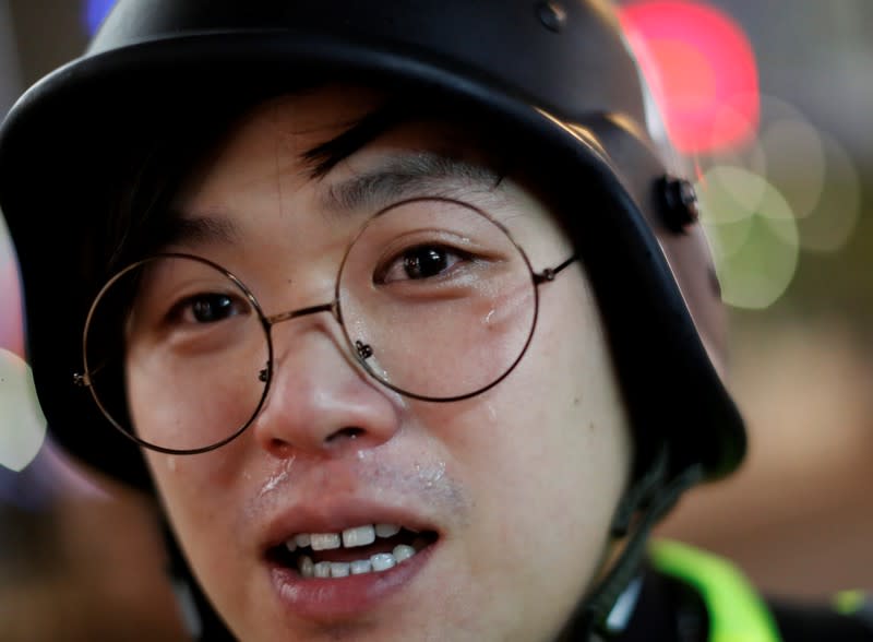 The Wider Image: Sermons with saline: Hong Kong pastor offers aid and prayers