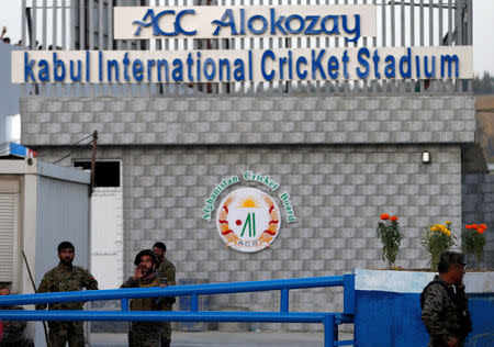 Afghan security force members stand guard at the gate of Kabul International Cricket Stadium after a suicide attack in Kabul, Afghanistan September 13, 2017. REUTERS/Mohammad Ismail