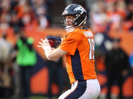 Nov 15, 2015; Denver, CO, USA; Denver Broncos quarterback Peyton Manning (18) prepares to throw a pass to pass the all time passing yard record during the first half against the Kansas City Chiefs at Sports Authority Field at Mile High. Mandatory Credit: Chris Humphreys-USA TODAY Sports