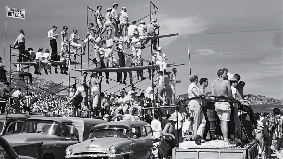 A photo from the late 1950s or early 1960s showing spectators at a sports-car race in California.