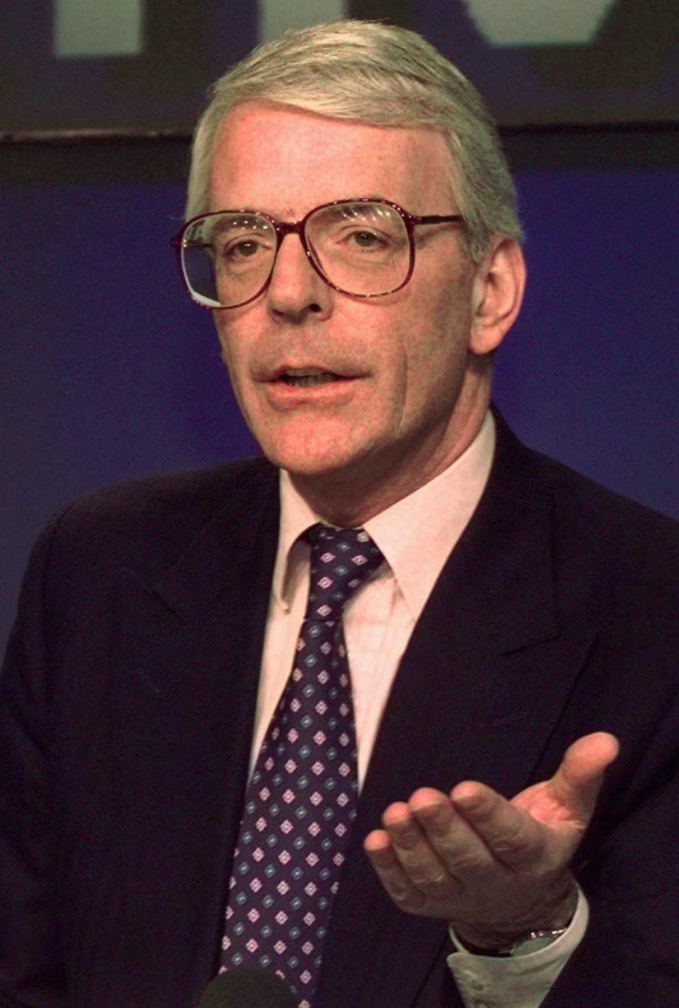 FILE - In this Wednesday, April 30, 1997 file photo Britain's the then Prime Minister John Major gestures at a press conference at the Conservative Party headquarters in London. (AP Photo/Lynne Sladky, file)