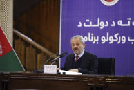 Afghanistan Health Minister Ferozuddin Feroz speaks with media during a news conference in Kabul, Afghanistan, Monday, Feb. 24, 2020. Afghanistan's Health Minister Ferozuddin Feroz says one of three persons suspected of having the coronavirus has tested positive in western Herat province bordering on Iran. (AP Photo)