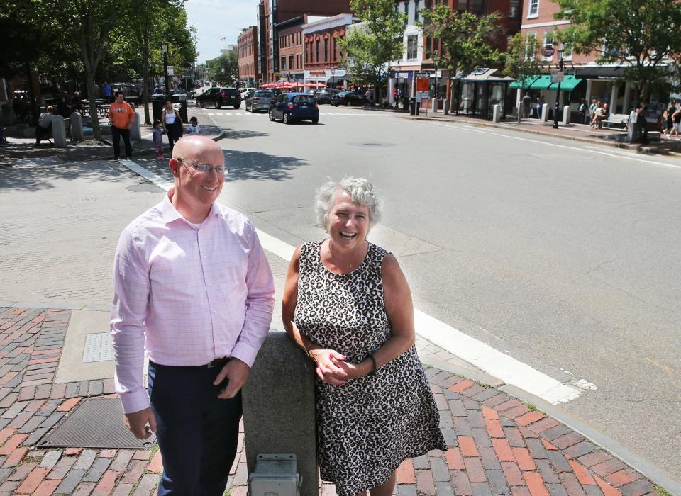 Ben VanCamp, president of the Chamber Collaborative of Greater Portsmouth, and Valerie Rochon, managing director of Portsmouth NH 400th Inc. and former president of the chamber, are revealing details about the upcoming downtown community dinner. There will be 900 people served dinner the length of Congress Street which is pictured behind them.