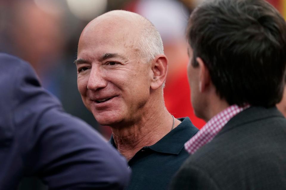 Amazon founder Jeff Bezos on the sidelines before the start of an NFL football game on Sept. 15, 2022, in Kansas City, Mo.