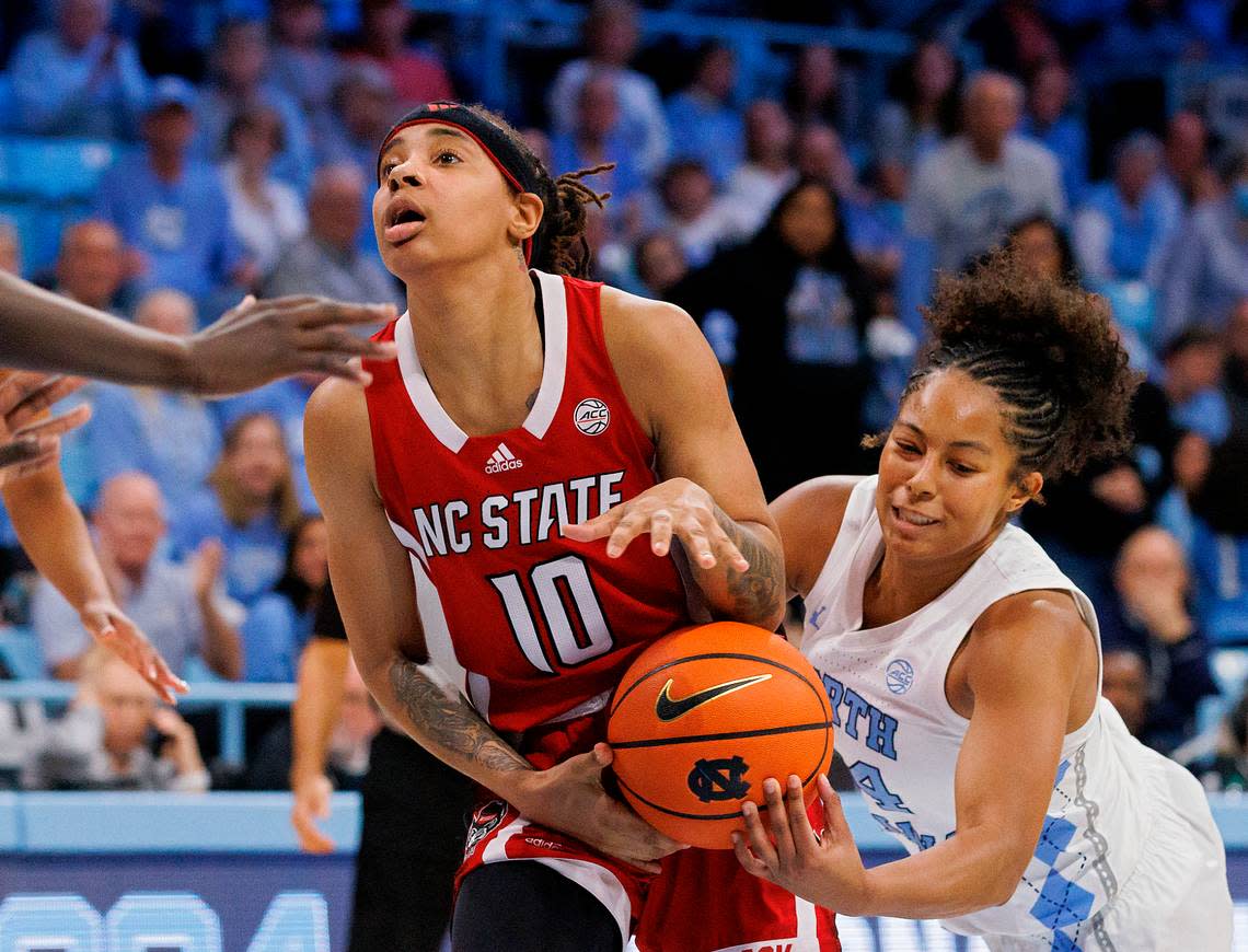North Carolina’s Indya Nivar strips the ball from N.C. State’s Aziaha James during the second half of the Tar Heels’ 80-70 win on Thursday, Feb. 22, 2024, at Carmichael Arena in Chapel Hill, N.C.