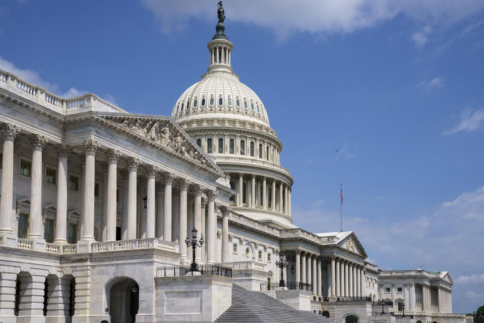 FILE - In this June 14, 2021, file photo the U.S. Capitol is seen in Washington as the House and Senate return to work. Congress is hunkered down, grinding through an eight-week stretch as the president’s Democratic allies in the House and Senate try to shape his big infrastructure ideas into bills that could actually be signed into law. Perhaps not since the drafting of Obamacare more than a decade ago has Washington tried a legislative lift as heavy as this. (AP Photo/J. Scott Applewhite, File)